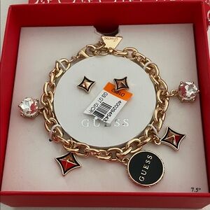 Guess charm bracelet and earring set